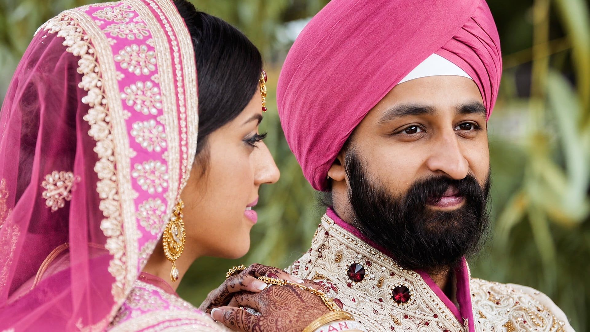 Riva, in a pink embroidered dupatta, and Harman, in a pink turban, share a quiet moment