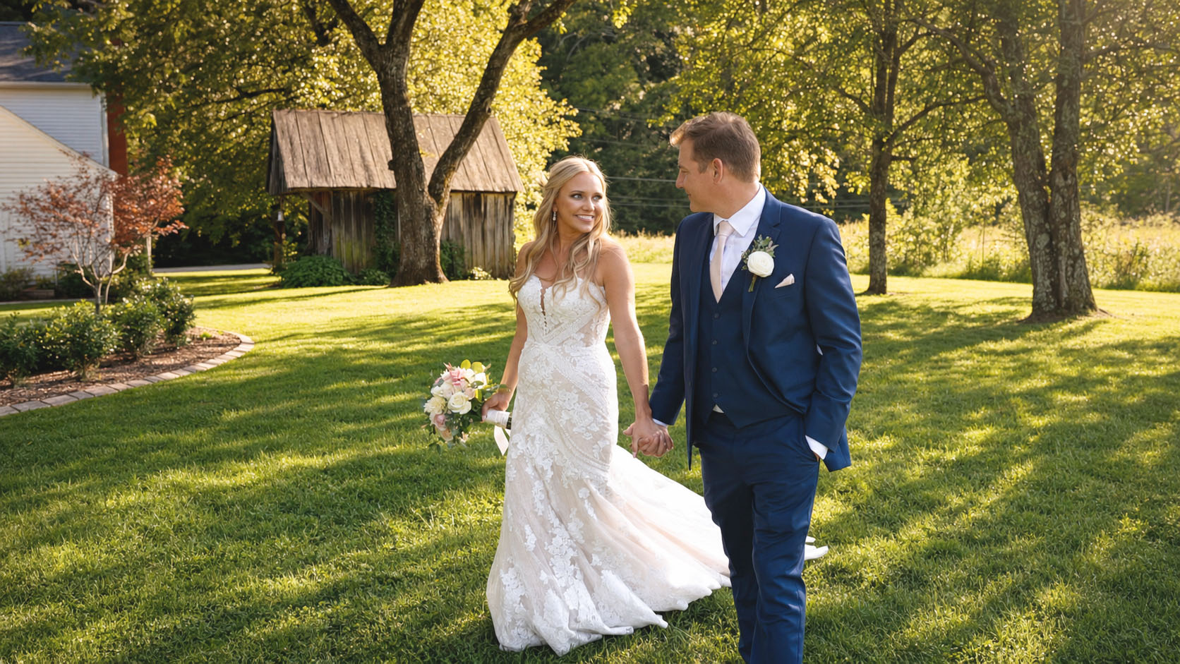 Ashlei and Reid walking and holding hands at Drakewood Farm in Nashville
