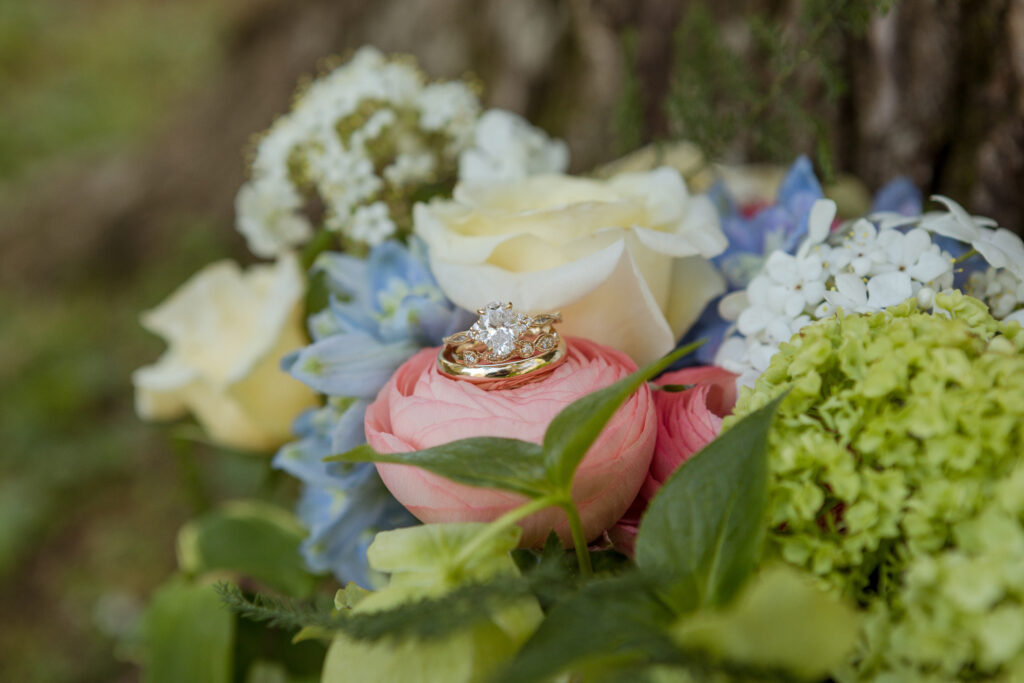 Our videographer and photographer worked together to style this creative wedding ring shot to include bride Mamie's bridal bouquet. 