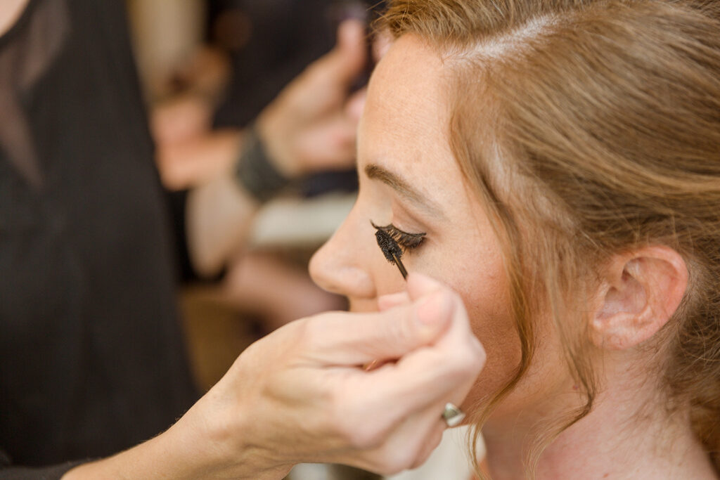 Sarah has her makeup applied at her Nashville wedding