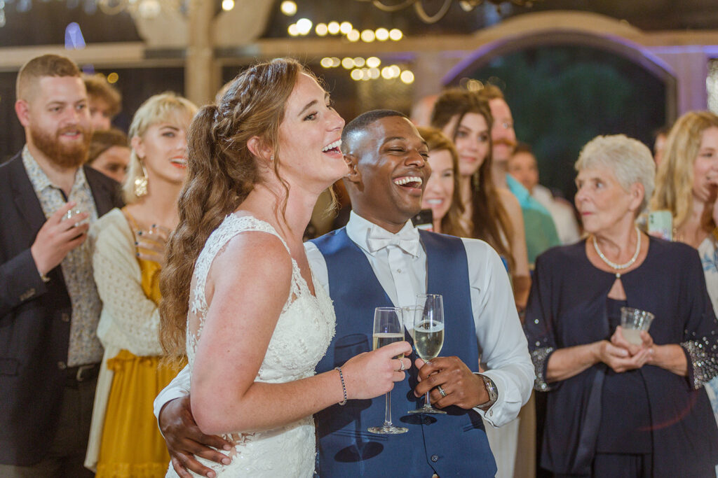 bride Sarah and groom ed enjoy speeches at their Nashville wedding reception 