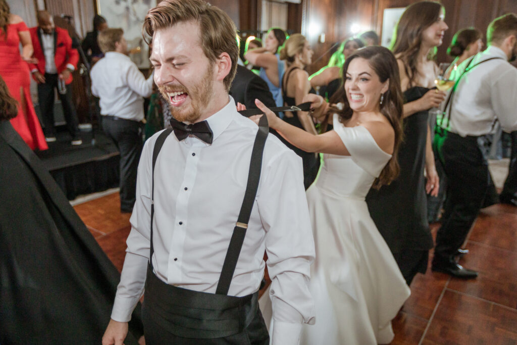 Shelby teases her brother on the dance floor at her Nashville luxury wedding 