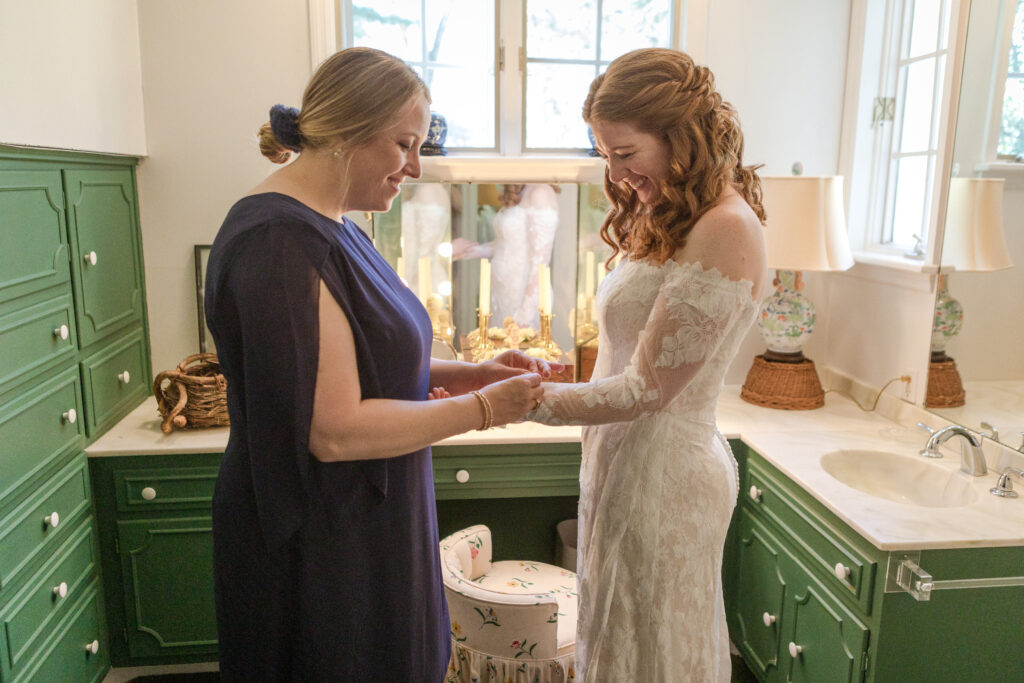 Bride Mamie and her sister share a moment before the micro wedding ceremony in Nashville, captured by their affordable wedding videographer.