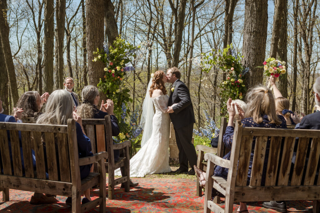 Mamie and Will kiss during their Nashville micro wedding ceremony with their best wedding photographers.