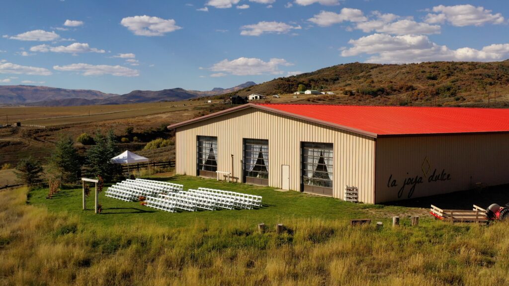 Steamboat Springs wedding venue La Joya Dulce's popular ceremony spot as seen from a drone camera perspective, courtesy of award-winning Nashville videographer With This Ring Wedding Films + Photo.