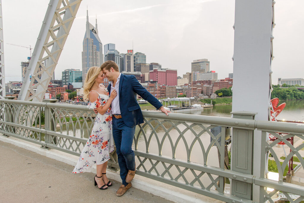 The Pedestrian Bridge in Nashville, where the couple shares a moment during their engagement photography  shoot.