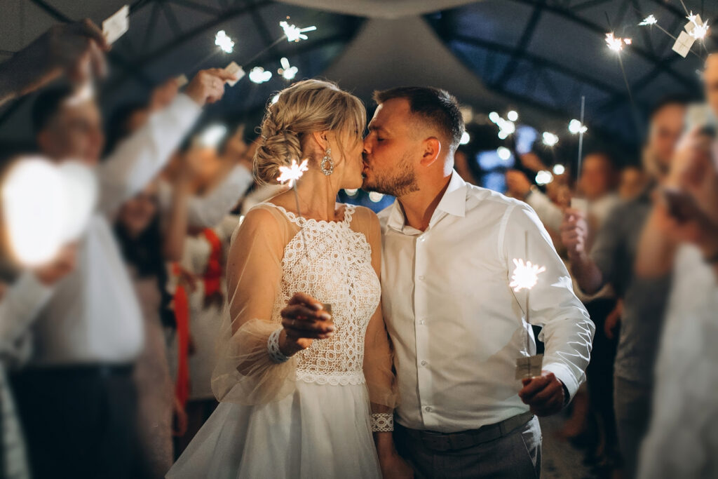 Nashville bride and groom kiss during beautiful sparkler exit