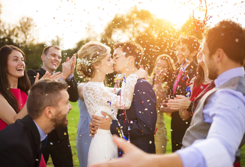 a bride and groom celebrate with their friends in Nashville with colorful confetti