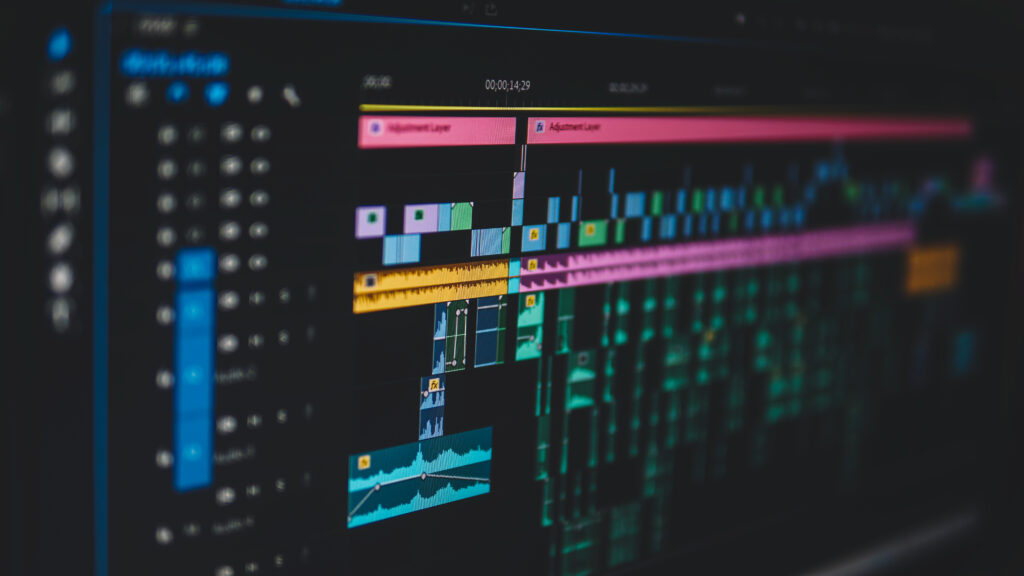 Close-up of a video editing software timeline showing color-coded audio and video tracks, representing the post-production process for a Nashville wedding video.
