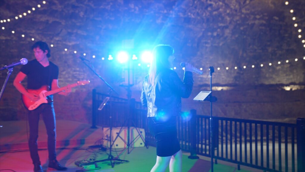 Live band performing inside Ruskin Cave during Kara and Jeremy’s ‘Rave in a Cave’ wedding reception in Dickson, TN. Captured by With This Ring, Nashville wedding videographers known for filming epic and unconventional wedding celebrations.